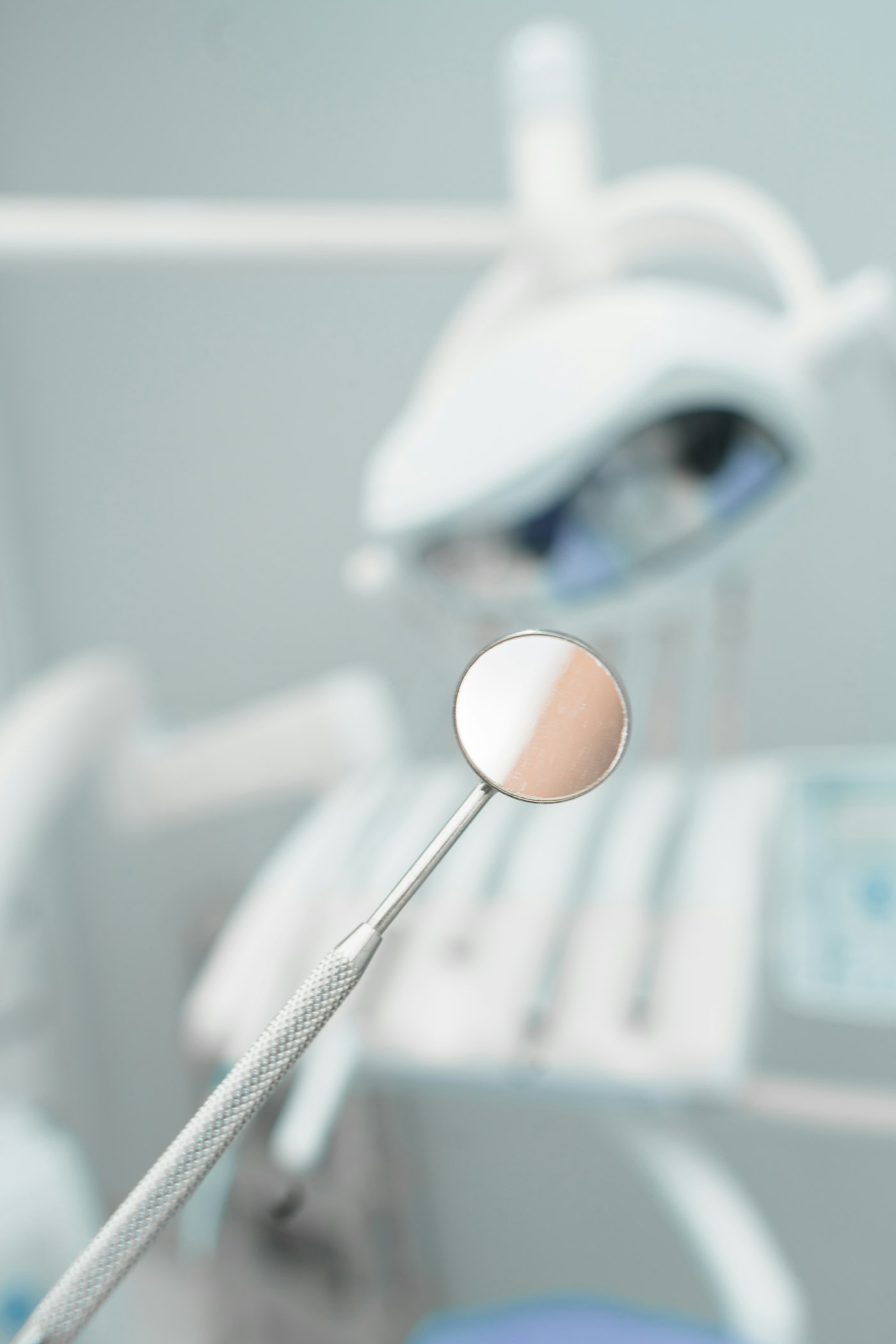 A dental mirror in a clinical setting
